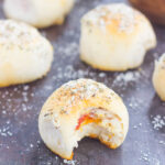 These Stuffed Pizza Rolls taste just like your favorite pizza, combined into a roll and drizzled with zesty, buttery glaze!