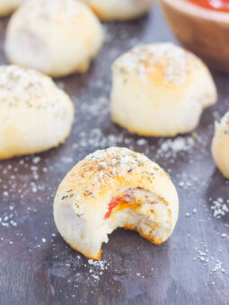 These Stuffed Pizza Rolls taste just like your favorite pizza, combined into a roll and drizzled with zesty, buttery glaze!