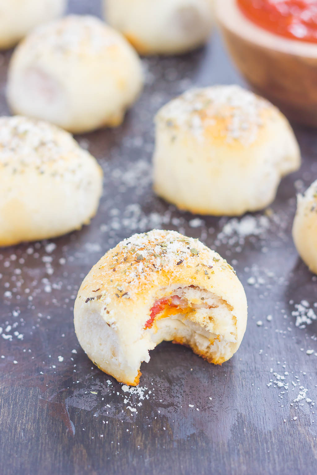 These Stuffed Pizza Rolls taste just like your favorite pizza, combined into a roll and drizzled with a zesty, buttery glaze!
