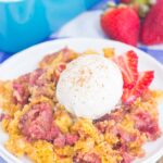 This Strawberry Cinnamon Dump Cake is a deliciously easy dessert that's loaded with flavor. With just four ingredients and hardly any prep time, this simple cake tastes like your favorite cobbler, but without all of the work. Filled with fresh strawberries, a hint of cinnamon and topped with a buttery, crumbly topping, this dessert is sure to be a winner all year long!