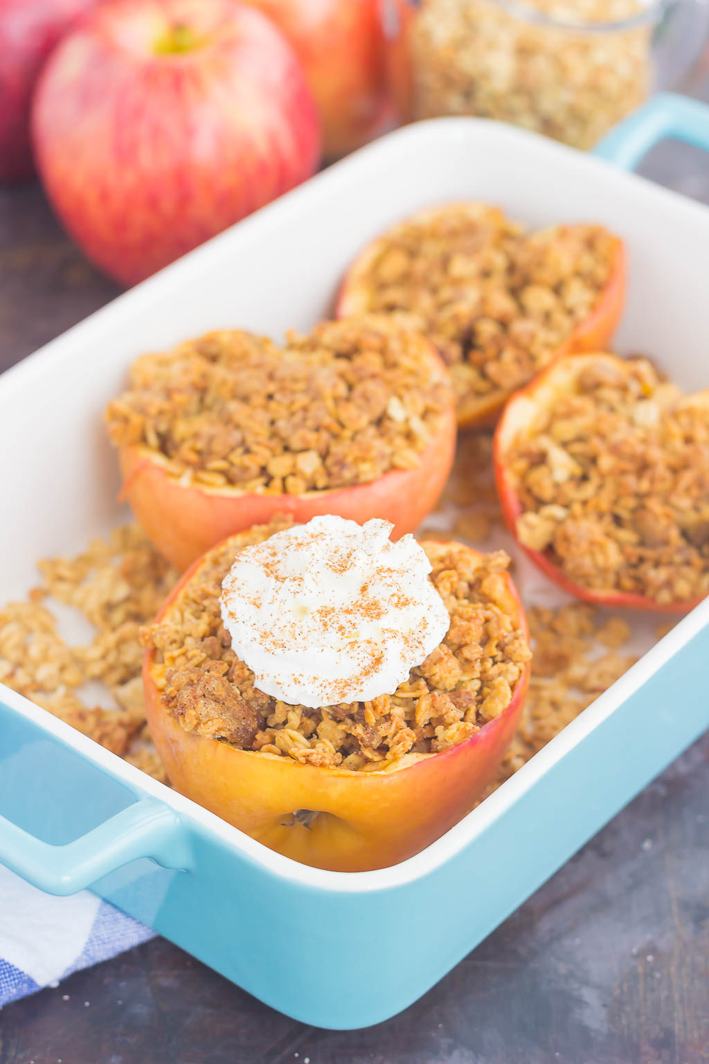 simple baked apples stuffed with granola in a baking dish 