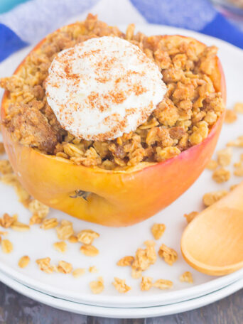 These Baked Apples with Granola make a simple breakfast, mid-morning snack, or easy dessert. Sweet apples are filled with a brown sugar granola mixture and then baked until tender. Top them with a dollop of ice cream or whipped cream and you'll be baking these over and over again!