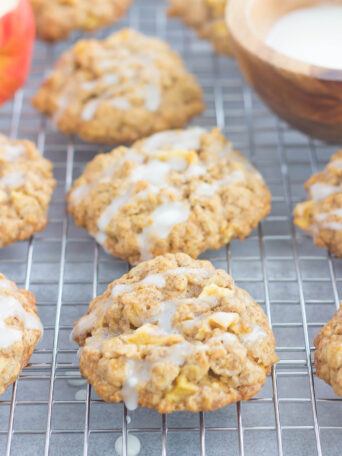 These Glazed Apple Oatmeal Cookies are soft, chewy and loaded with flavor. Packed with chunks of apples, fall spices and topped with a deliciously sweet glaze, you'll be making this easy cookie all season long!