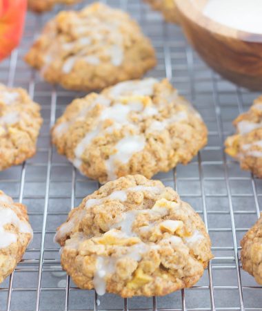 These Glazed Apple Oatmeal Cookies are soft, chewy and loaded with flavor. Packed with chunks of apples, fall spices and topped with a deliciously sweet glaze, you'll be making this easy cookie all season long!
