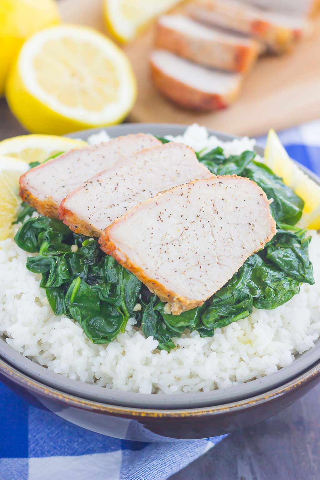This Grilled Garlic Herb Pork Bowl is an easy meal that's loaded with flavor. Marinated pork loin filet is prepared on the grill and then tossed with some white rice and sautéed spinach. Simple to make a perfect for busy weeknights, this hearty dinner is sure to be a favorite all year long!