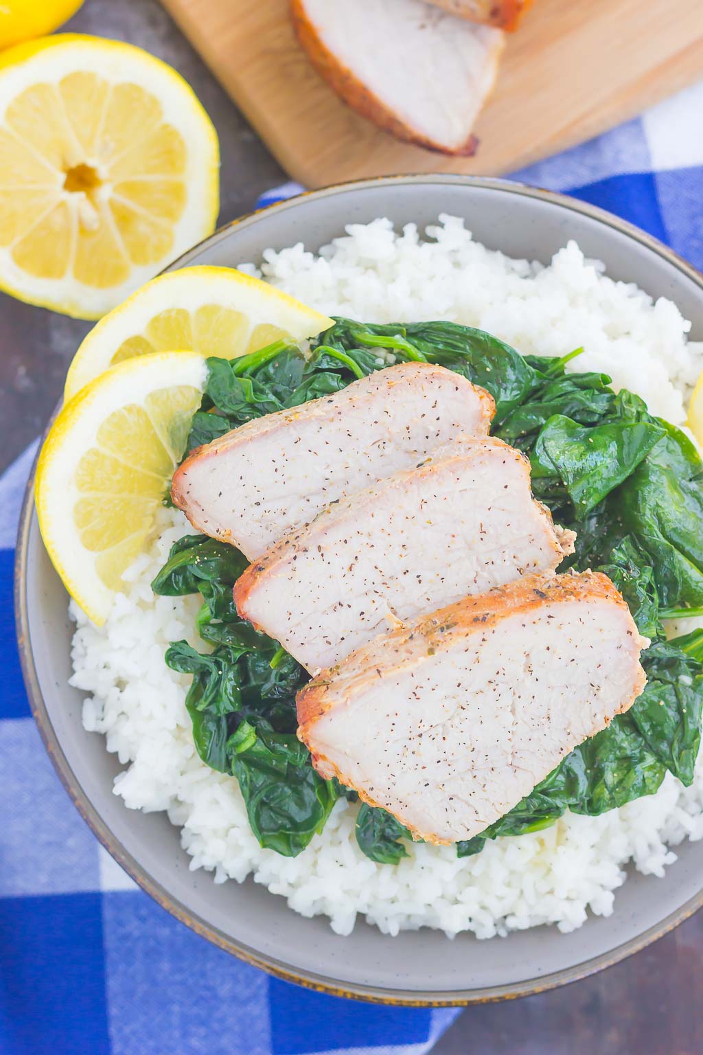 This Grilled Garlic Herb Pork Bowl is an easy meal that's loaded with flavor. Marinated pork loin filet is prepared on the grill and then tossed with some white rice and sautéed spinach. Simple to make a perfect for busy weeknights, this hearty dinner is sure to be a favorite all year long!