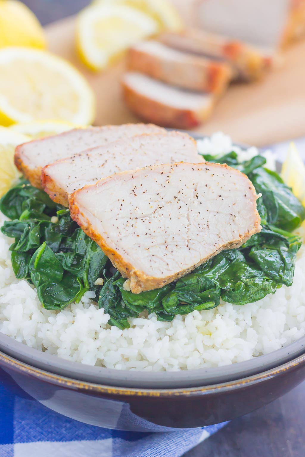 This Grilled Garlic Herb Pork Bowl is an easy meal that's loaded with flavor. Marinated pork loin filet is prepared on the grill and then tossed with some white rice and sautéed spinach. Simple to make a perfect for busy weeknights, this hearty dinner is sure to be a favorite all year long!