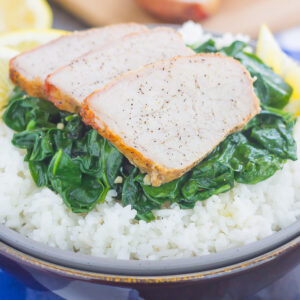 This Grilled Garlic Herb Pork Bowl is an easy meal that's loaded with flavor. Marinated pork loin filet is prepared on the grill and then tossed with some white rice and sautéed spinach. Simple to make a perfect for busy weeknights, this hearty dinner is sure to be a favorite all year long!