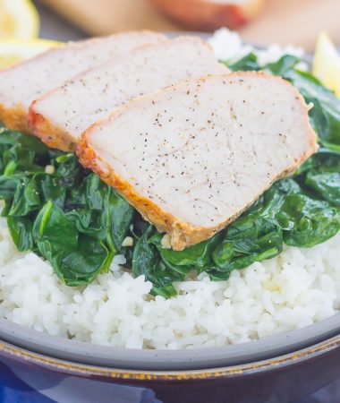 This Grilled Garlic Herb Pork Bowl is an easy meal that's loaded with flavor. Marinated pork loin filet is prepared on the grill and then tossed with some white rice and sautéed spinach. Simple to make a perfect for busy weeknights, this hearty dinner is sure to be a favorite all year long!