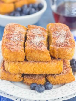 Baked Cinnamon Sugar French Toast Sticks make an easy breakfast that's loaded with flavor. Simple to prepare and baked in the oven, you can have these sticks ready to serve in no time, with a side of syrup for dunking!