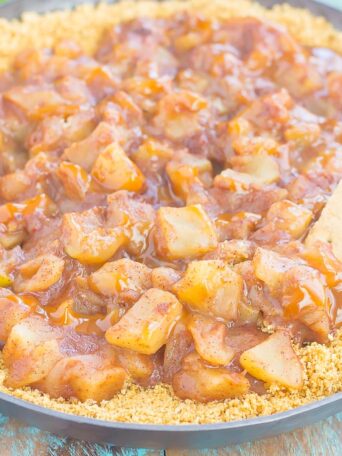 This Easy Caramel Apple Pie Dip tastes just like the classic pie, but without all of the prep work. Fresh apples are tossed with spices and then sautéed until tender. Drizzled with caramel and loaded onto a buttery graham cracker crust, this simple dessert is loaded with fall flavors!