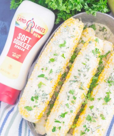 Parmesan herb corn on the cob in a silver tray