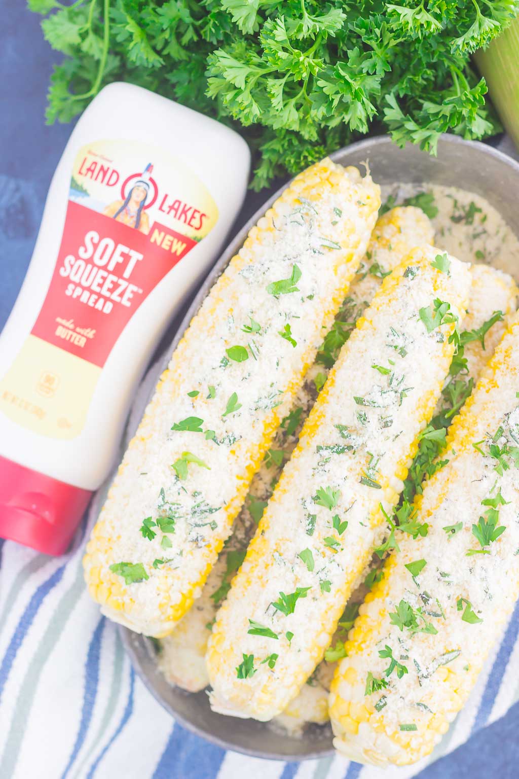 This Parmesan Herb Corn on the Cob is an easy side dish that's loaded with flavor. A buttery spread of Parmesan, garlic and herbs top fresh corn that's roasted to perfection. With just a few ingredients, you can have this simple dish ready in no time!