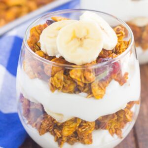 yogurt, pumpkin granola, banana slices layered in a glass