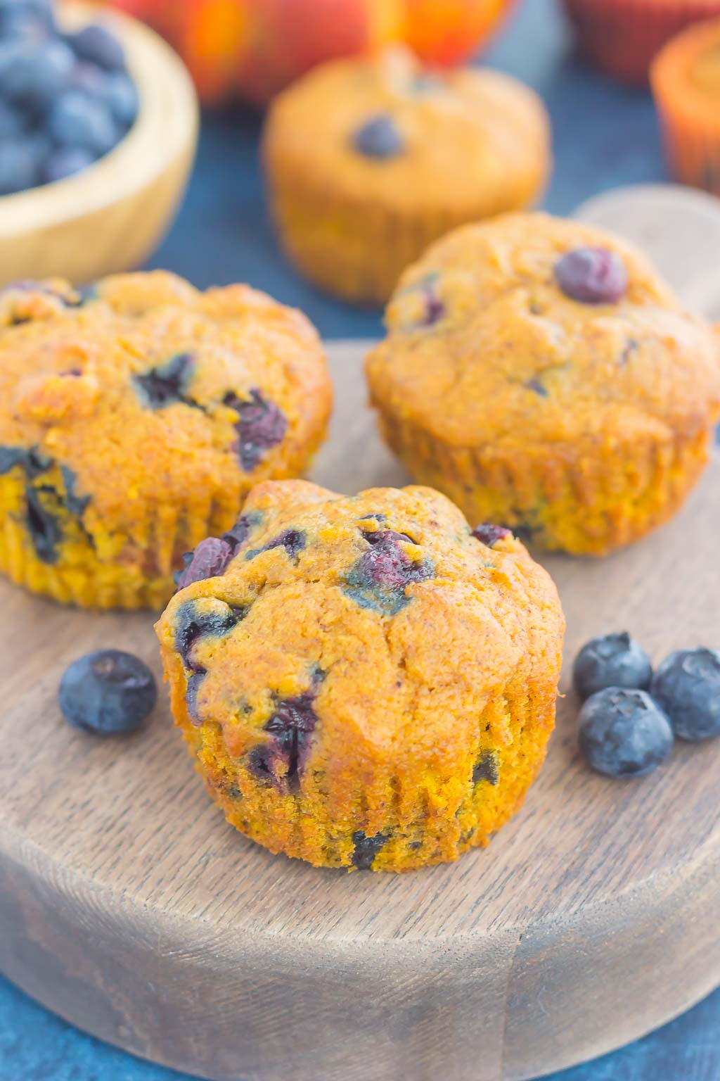 These Pumpkin Blueberry Muffins are soft, moist and bursting with cozy fall flavors. Packed with sweet pumpkin and juicy blueberries, this easy treat makes the perfect fall breakfast or snack! #pumpkinmuffins #pumpkinblueberrymuffins #muffins #blueberrymuffins #pumpkinbreakfast #pumpkindessert #falldessert #dessert #breakfast