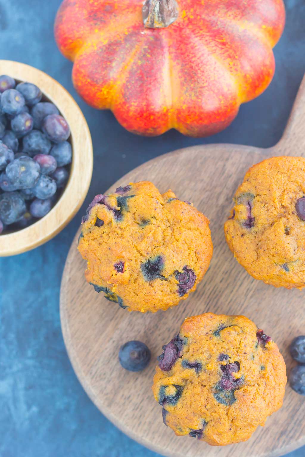 These Pumpkin Blueberry Muffins are soft, moist and bursting with cozy fall flavors. Packed with sweet pumpkin and juicy blueberries, this easy treat makes the perfect fall breakfast or snack! #pumpkinmuffins #pumpkinblueberrymuffins #muffins #blueberrymuffins #pumpkinbreakfast #pumpkindessert #falldessert #dessert #breakfast