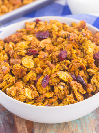 This Pumpkin Spice Granola is a delicious way to savor the flavors of fall. Hearty oats, crunchy walnuts, dried cranberries and fall spices give this granola both texture and flavor. It's simple to make and perfect to eat by the handful, with milk, or on top of yogurt or ice cream!