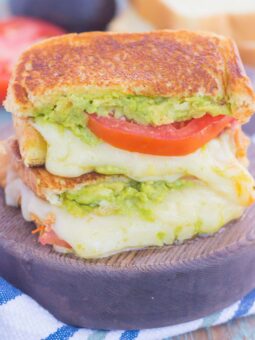 Tomato, Avocado and Mozzarella Grilled Cheese is filled with fresh tomato slices, smashed avocado and creamy mozzarella cheese. Grilled until golden on the outside and melty on the inside, this sandwich is perfect to pair with soup for an easy lunch or dinner!