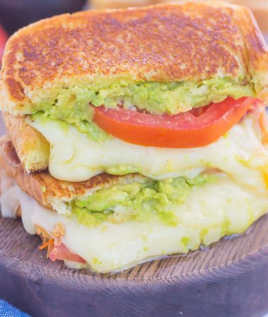 Tomato, Avocado and Mozzarella Grilled Cheese is filled with fresh tomato slices, smashed avocado and creamy mozzarella cheese. Grilled until golden on the outside and melty on the inside, this sandwich is perfect to pair with soup for an easy lunch or dinner!