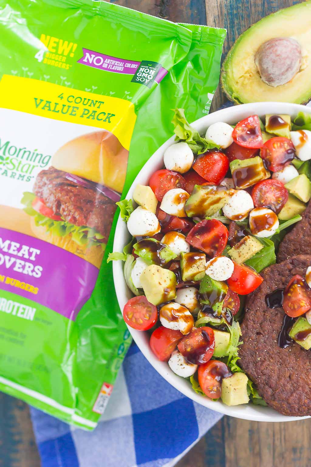 This Avocado Caprese Burger Salad is a healthier way to switch up your meal routine. It's packed with diced avocado, cherry tomatoes, mozzarella pearls, veggie burgers and drizzled with a sweet balsamic glaze. Simple to make and perfect for just about any time, you'll love the delicious taste of this flavorful salad!
