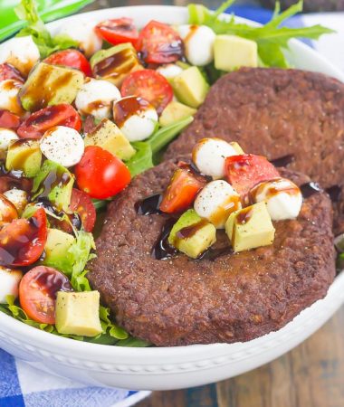 This Avocado Caprese Burger Salad is a healthier way to switch up your meal routine. It's packed with diced avocado, cherry tomatoes, mozzarella pearls, veggie burgers and drizzled with a sweet balsamic glaze. Simple to make and perfect for just about any time, you'll love the delicious taste of this flavorful salad!