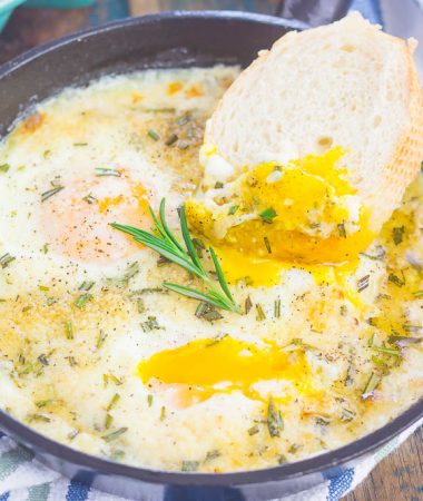 Baked Eggs with Rosemary and Thyme make a simple breakfast that's loaded with flavor. Fresh herbs and a sprinkling of cheese give this dish a savory blend that's perfect for a cozy dish. Serve with a side of crusty bread and this will quickly become a new favorite!