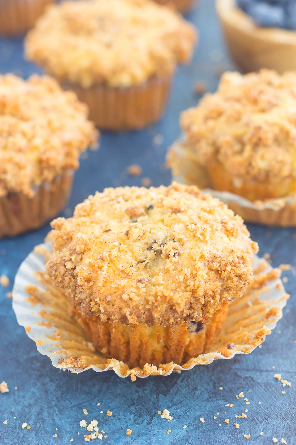 These Blueberry Cheesecake Muffins make a delicious breakfast or easy dessert. Filled with tangy blueberries, a sweet cheesecake filling and topped with a buttery streusel, these muffins will quickly become everyone's favorite treat!