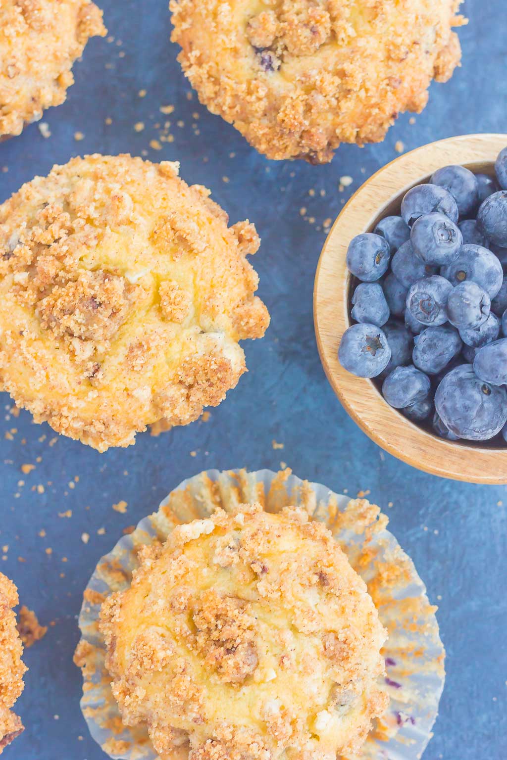 These Blueberry Cheesecake Muffins make a delicious breakfast or easy dessert. Filled with tangy blueberries, a sweet cheesecake filling and topped with a buttery streusel, these muffins will quickly become everyone's favorite treat!