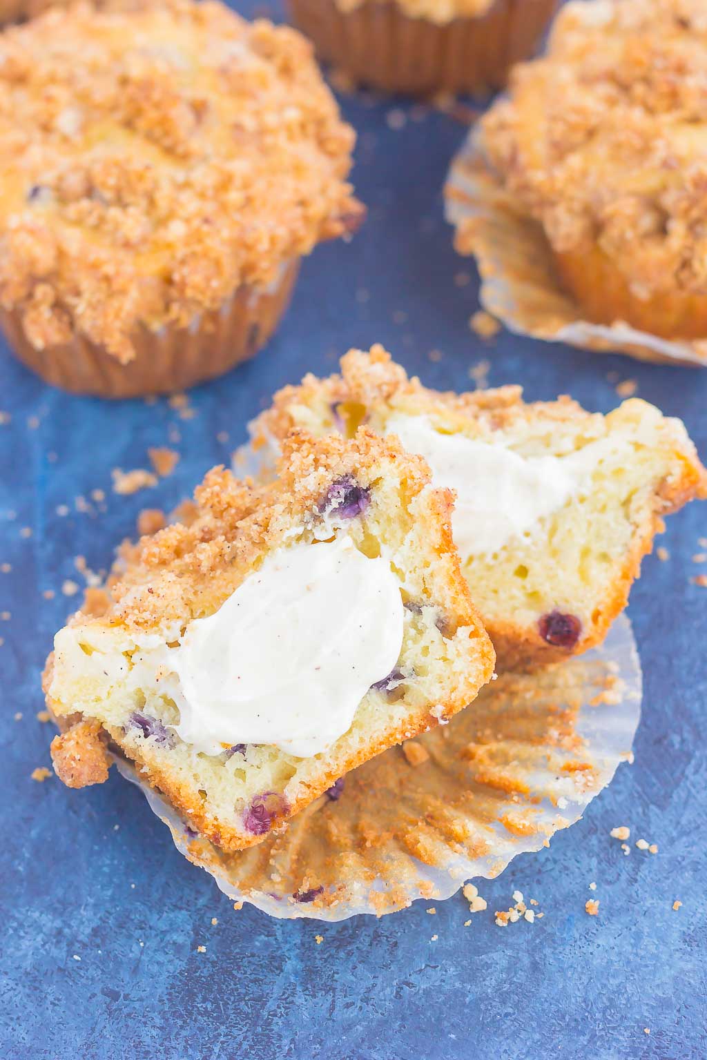 These Blueberry Cheesecake Muffins make a delicious breakfast or easy dessert. Filled with tangy blueberries, a sweet cheesecake filling and topped with a buttery streusel, these muffins will quickly become everyone's favorite treat!