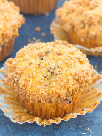 These Blueberry Cheesecake Muffins make a delicious breakfast or easy dessert. Filled with tangy blueberries, a sweet cheesecake filling and topped with a buttery streusel, these muffins will quickly become everyone's favorite treat!