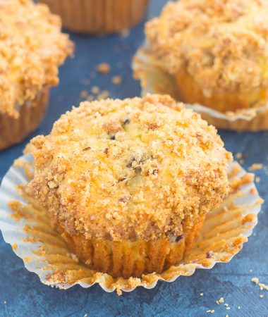 These Blueberry Cheesecake Muffins make a delicious breakfast or easy dessert. Filled with tangy blueberries, a sweet cheesecake filling and topped with a buttery streusel, these muffins will quickly become everyone's favorite treat!