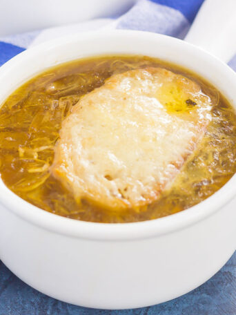 French Onion Soup is loaded with caramelized onions, a rich and savory broth, and just the right amount of spices. It takes just minutes to prepare, letting your stove do the rest of the work. Topped with a piece of French bread and smothered with melted cheese, this is the ultimate soup to warm you up on a chilly day!