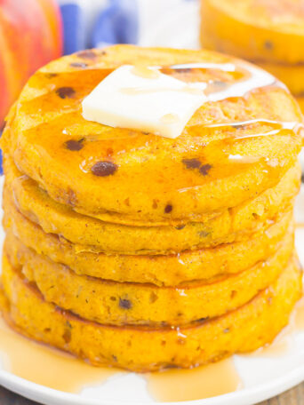 These Pumpkin Chocolate Chip Pancakes make a deliciously cozy breakfast for fall. Filled with sweet pumpkin and bursting with chocolate chips, these simple pancakes are soft, fluffy and so easy to make! 
