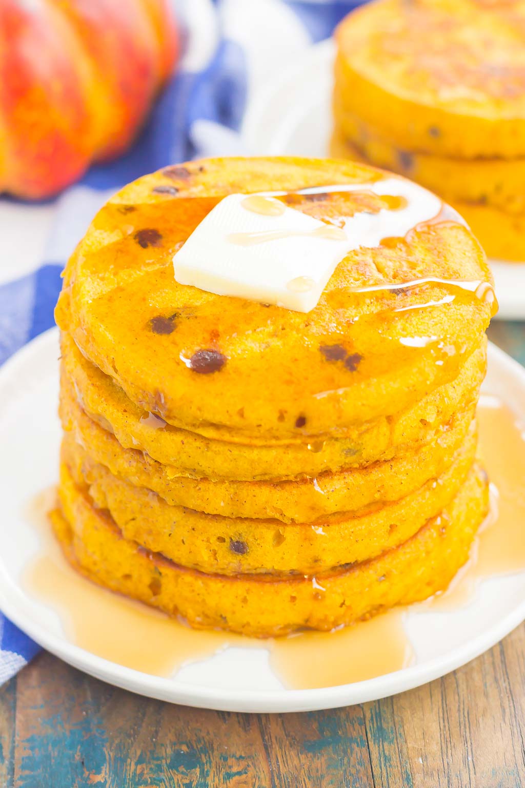 These Pumpkin Chocolate Chip Pancakes make a deliciously cozy breakfast for fall. Filled with sweet pumpkin and bursting with chocolate chips, these simple pancakes are soft, fluffy and so easy to make! 