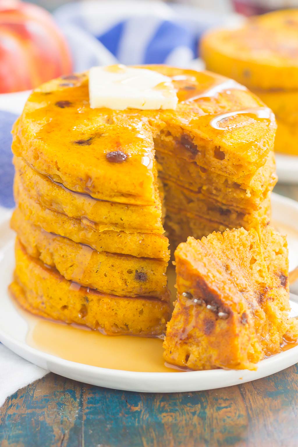 These Pumpkin Chocolate Chip Pancakes make a deliciously cozy breakfast for fall. Filled with sweet pumpkin and bursting with chocolate chips, these simple pancakes are soft, fluffy and so easy to make!  #pancakes #pumpkinpancakes #chocolatechippancakes #pancakerecipe #breakfast