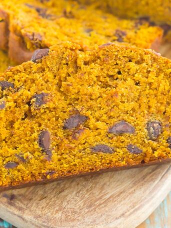 This Pumpkin Peanut Butter Spice Bread is filled with a warm pumpkin flavor, dark chocolate chips, and creamy peanut butter. Easy to make and filled with an irresistible combination, this spiced bread will become your favorite breakfast or dessert of the season!