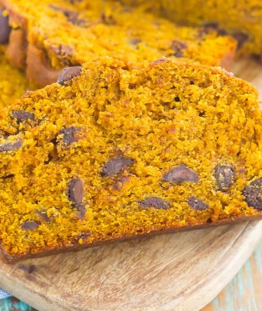 This Pumpkin Peanut Butter Spice Bread is filled with a warm pumpkin flavor, dark chocolate chips, and creamy peanut butter. Easy to make and filled with an irresistible combination, this spiced bread will become your favorite breakfast or dessert of the season!