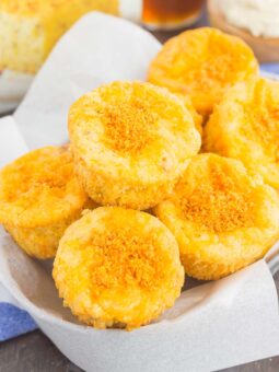These Cheesy Cornbread Muffins are loaded with flavor and easy to make. Filled with cheddar cheese, zesty spices and baked until golden, these muffins are perfect to serve as a simple side dish or snack!