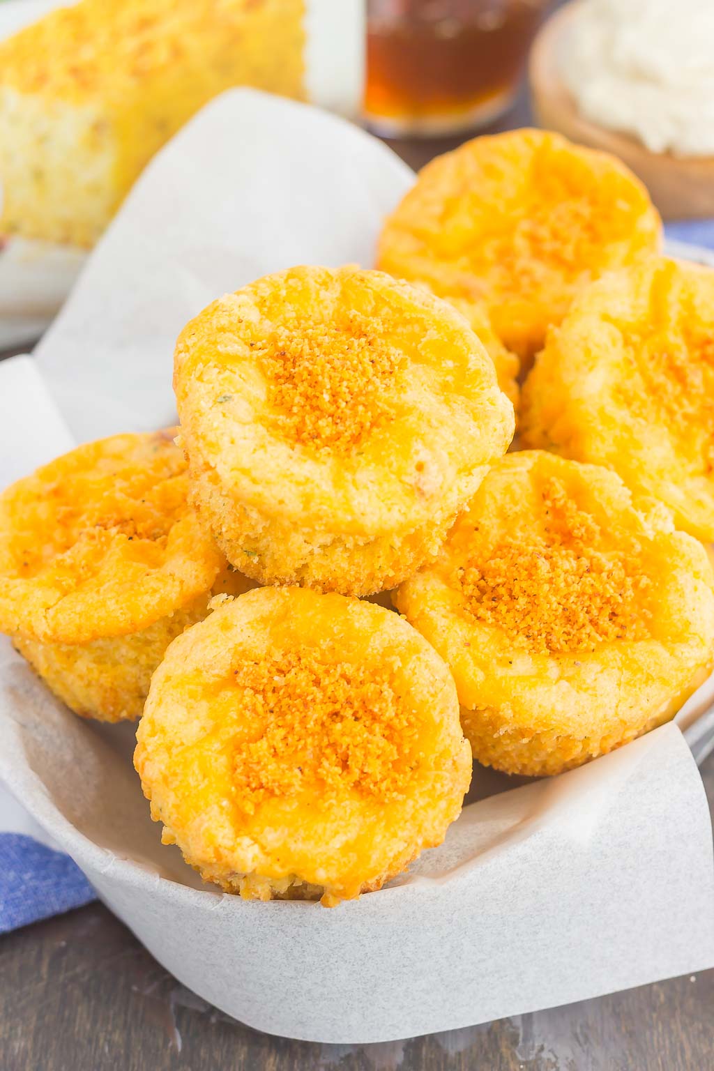 These Cheesy Cornbread Muffins are loaded with flavor and easy to make. Filled with cheddar cheese, zesty spices and baked until golden, these muffins are perfect to serve as a simple side dish or snack!