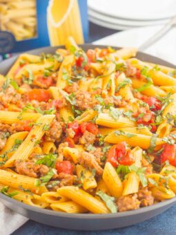 This Tomato Basil Pasta with Italian Sausage is an easy, one pan meal that's perfect for busy weeknights. Filled with tender pasta, Italian sausage, and tossed in a simple tomato basil sauce, this dish is ready in less than 30 minutes and will become a new dinnertime favorite!