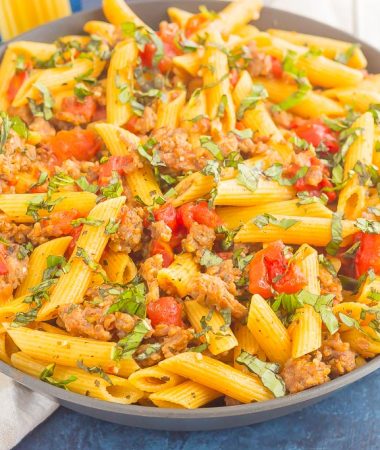 This Tomato Basil Pasta with Italian Sausage is an easy, one pan meal that's perfect for busy weeknights. Filled with tender pasta, Italian sausage, and tossed in a simple tomato basil sauce, this dish is ready in less than 30 minutes and will become a new dinnertime favorite!