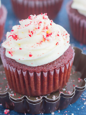 These Peppermint Red Velvet Cupcakes are light, fluffy, and bursting with sweet chocolate and hint of peppermint. Simple to make and topped with a swirl of peppermint frosting, these festive cupcakes will be the hit of the holiday season!