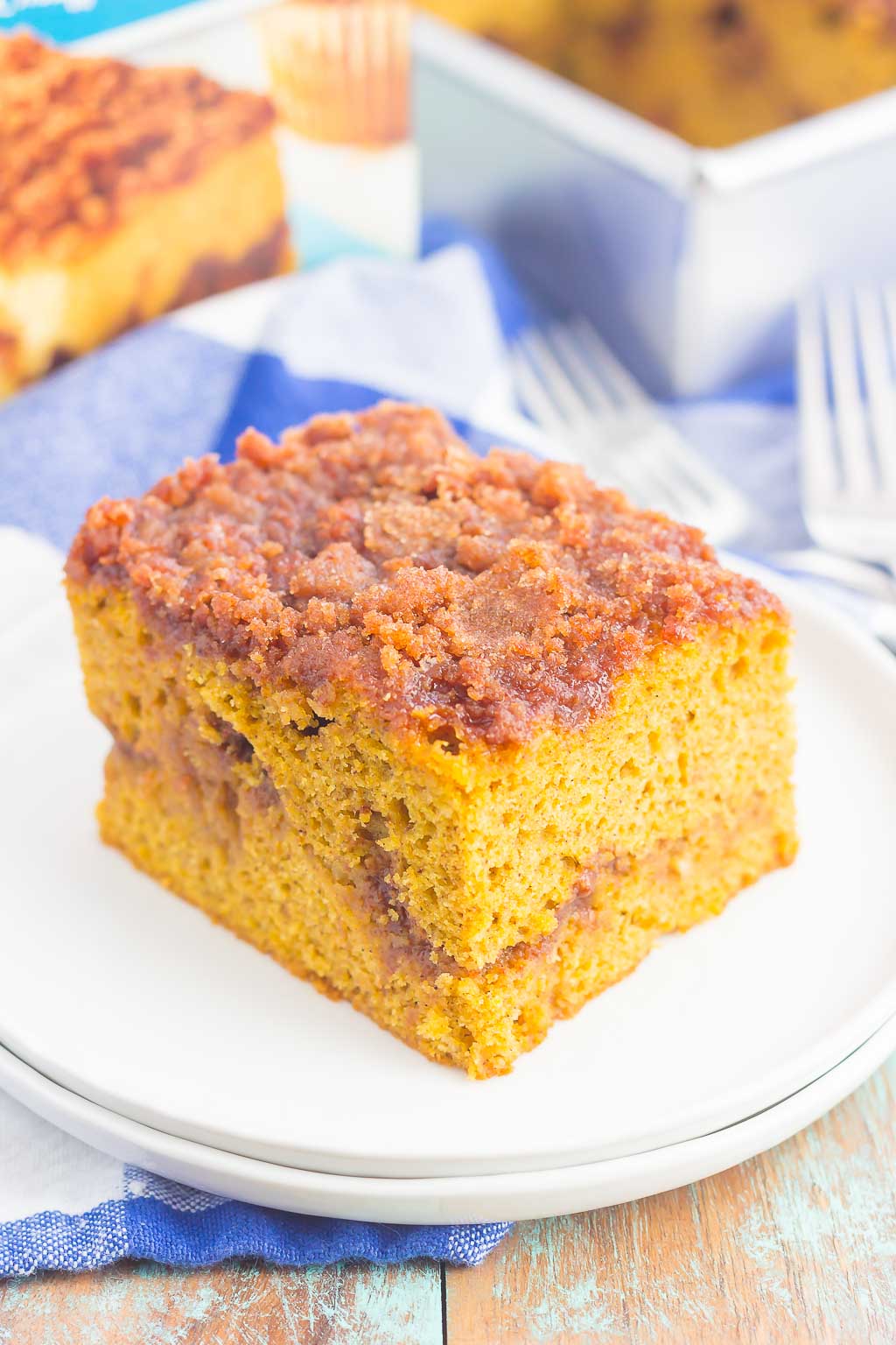 This Gluten Free Pumpkin Cinnamon Crumb Cake requires just a few ingredients and is ready in no time. Fluffy pumpkin cake is swirled with a sweet cinnamon streusel and then baked until golden. This easy cake is perfect to serve at all of your holiday gatherings!