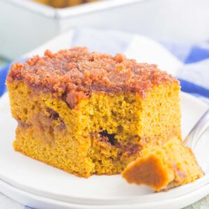 This Gluten Free Pumpkin Cinnamon Crumb Cake requires just a few ingredients and is ready in no time. Fluffy pumpkin cake is swirled with a sweet cinnamon streusel and then baked until golden. This easy cake is perfect to serve at all of your holiday gatherings!