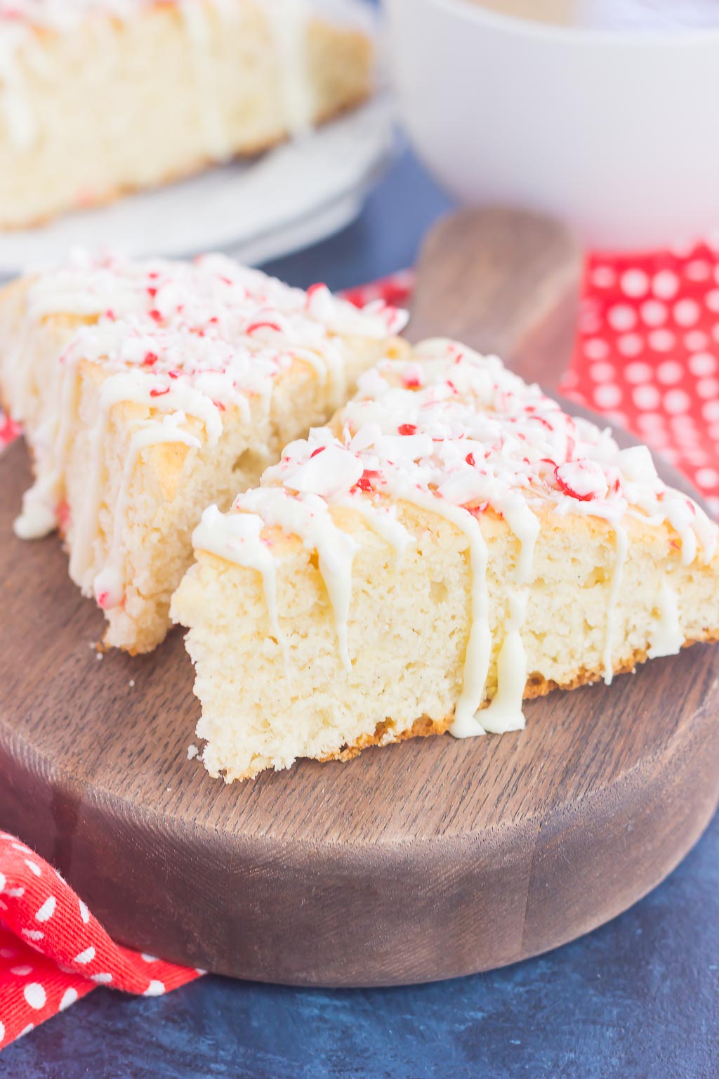 These White Chocolate Peppermint Scones are light, fluffy and bursting with flavor. Filled with hints of peppermint and topped with a white chocolate and peppermint glaze, these soft scones make the best holiday breakfast or dessert!