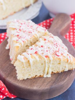 These White Chocolate Peppermint Scones are light, fluffy and bursting with flavor. Filled with hints of peppermint and topped with a white chocolate and peppermint glaze, these soft scones make the best holiday breakfast or dessert!