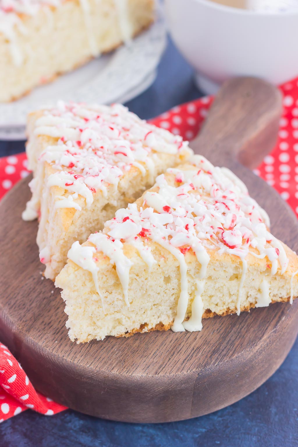 These White Chocolate Peppermint Scones are light, fluffy and bursting with flavor. Filled with hints of peppermint and topped with a white chocolate and peppermint glaze, these soft scones make the best holiday breakfast or dessert!