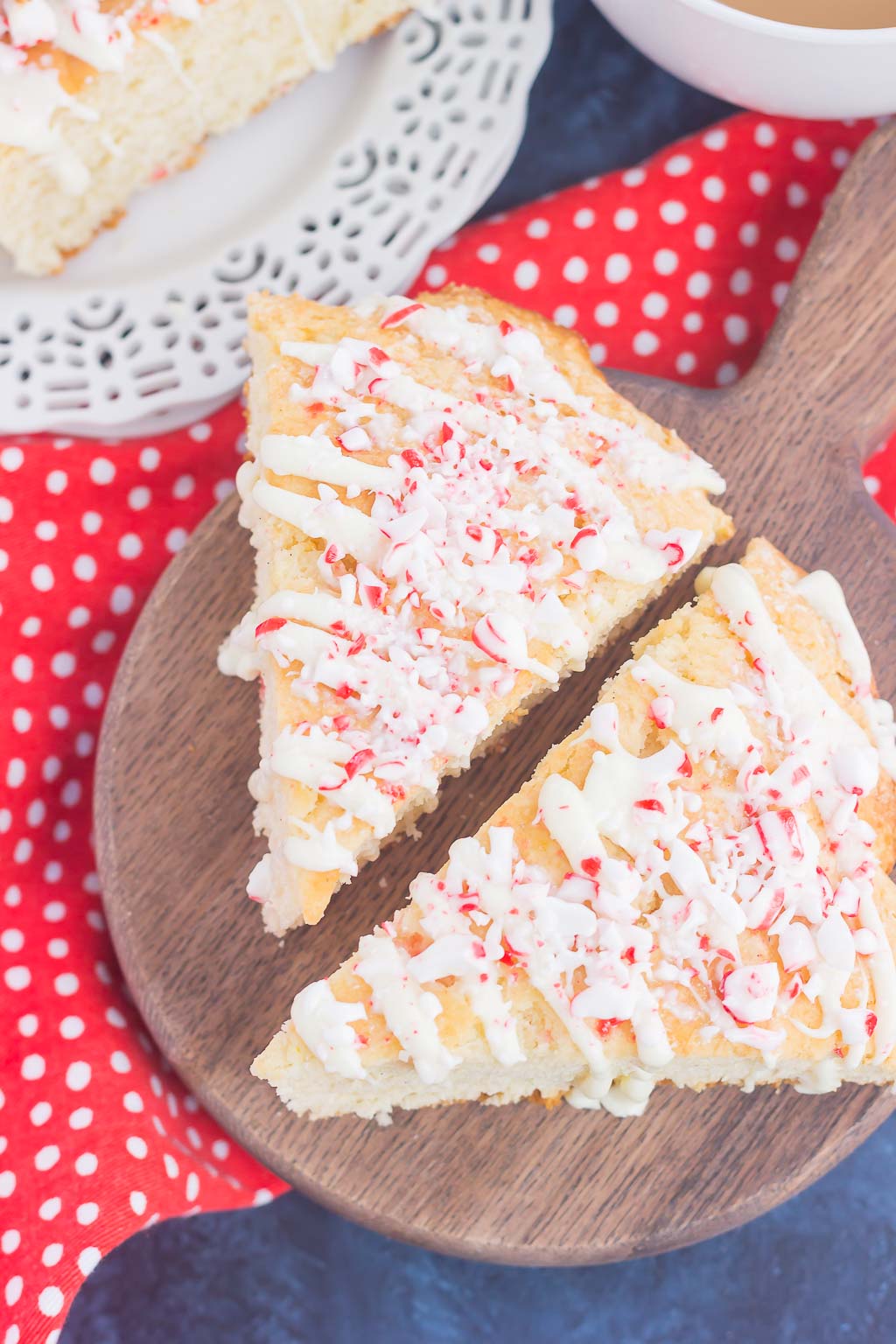 These White Chocolate Peppermint Scones are light, fluffy and bursting with flavor. Filled with hints of peppermint and topped with a white chocolate and peppermint glaze, these soft scones make the best holiday breakfast or dessert!