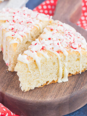 These White Chocolate Peppermint Scones are light, fluffy and bursting with flavor. Filled with hints of peppermint and topped with a white chocolate and peppermint glaze, these soft scones make the best holiday breakfast or dessert!