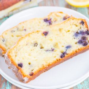 This Lemon Blueberry Bread is perfectly sweet, moist, and simple to make. An easy lemon glaze adds a touch of sweetness that makes this bread perfect for breakfast or dessert!